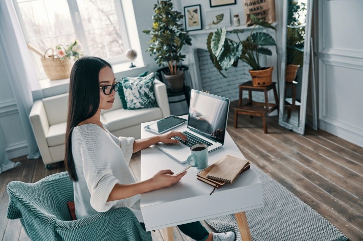 Young Woman Working Using a laptop